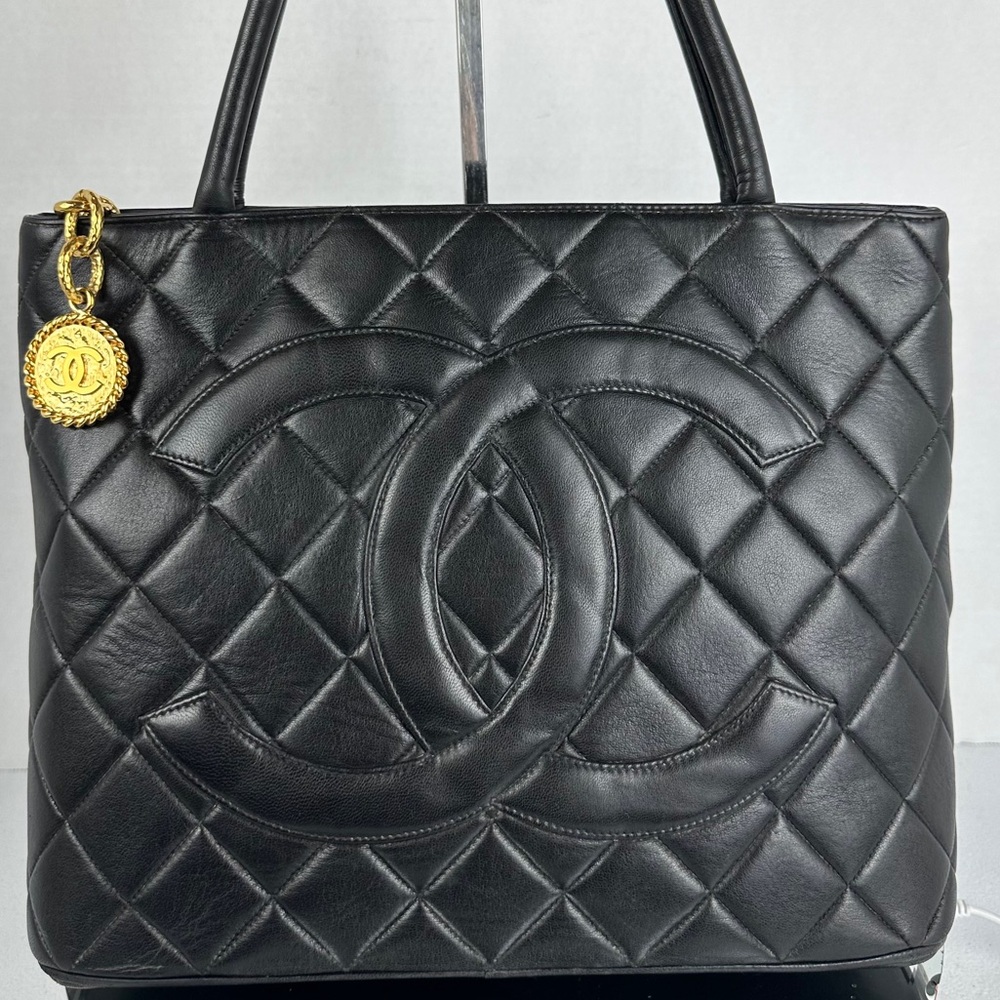 CHANEL Black Quilted Tote with Gold Medallion
